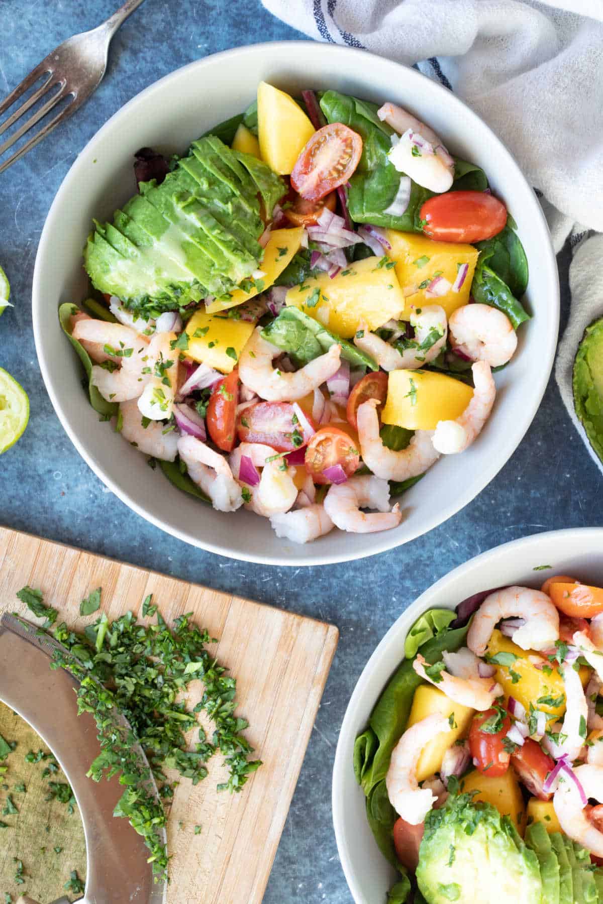 Prawn avocado salad in a grey bowl.