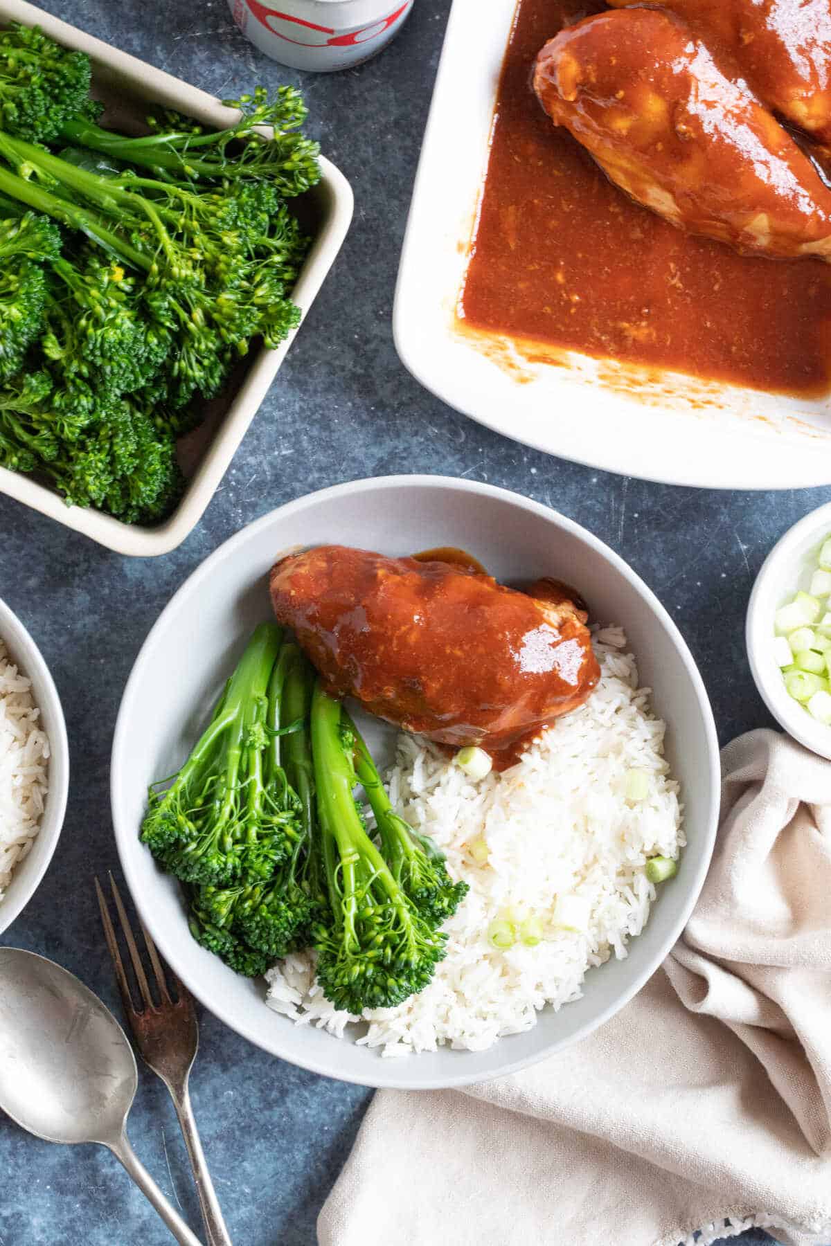 Diet coke chicken breast served with rice and broccoli.