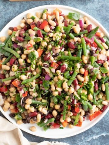 Five bean salad on a white serving plate.
