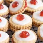 Empire biscuits topped with glace cherry.