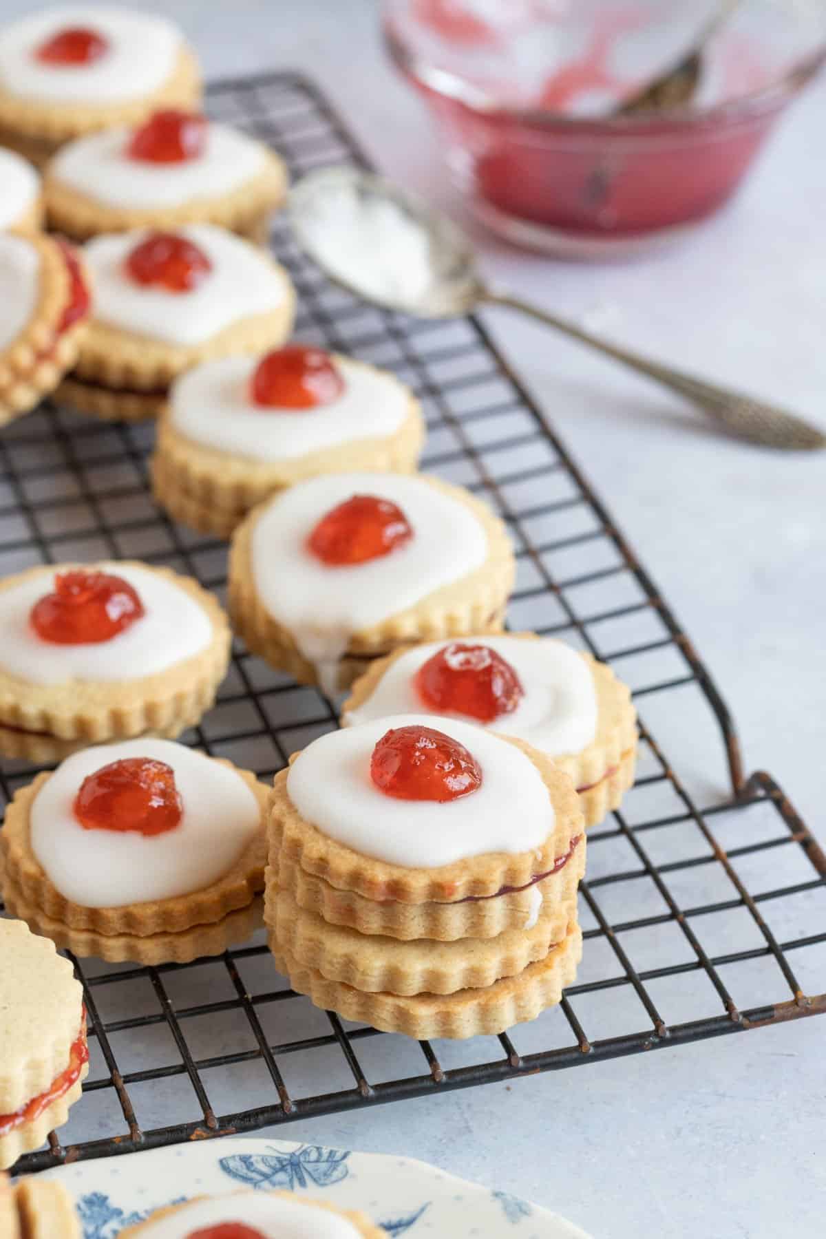 Iced Empire cookies on a cooling rack.