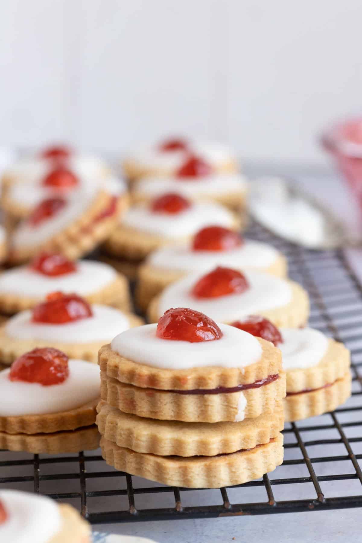 A stack of Empire biscuits on a wire rack.