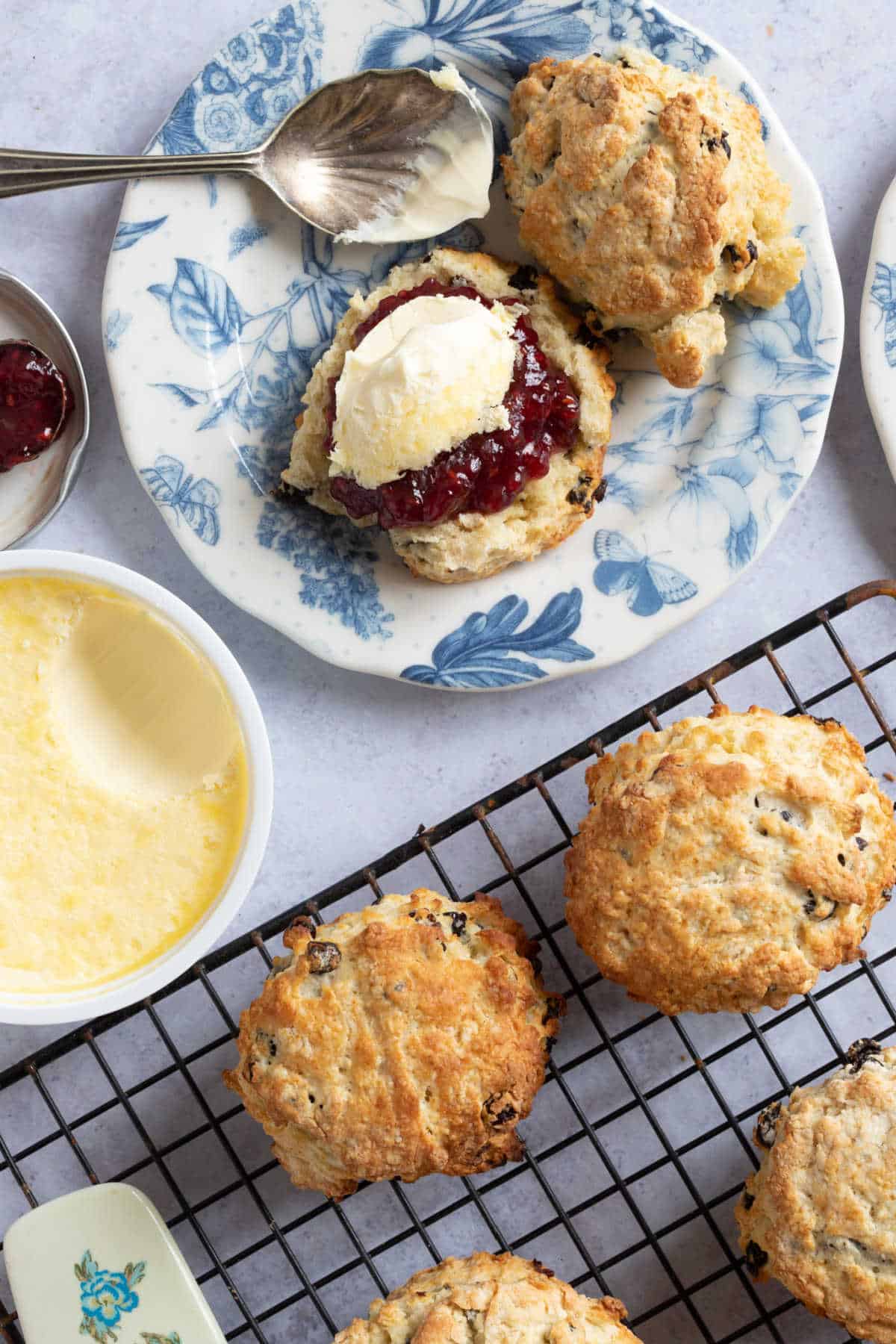 Fruit scones on a wire rack.