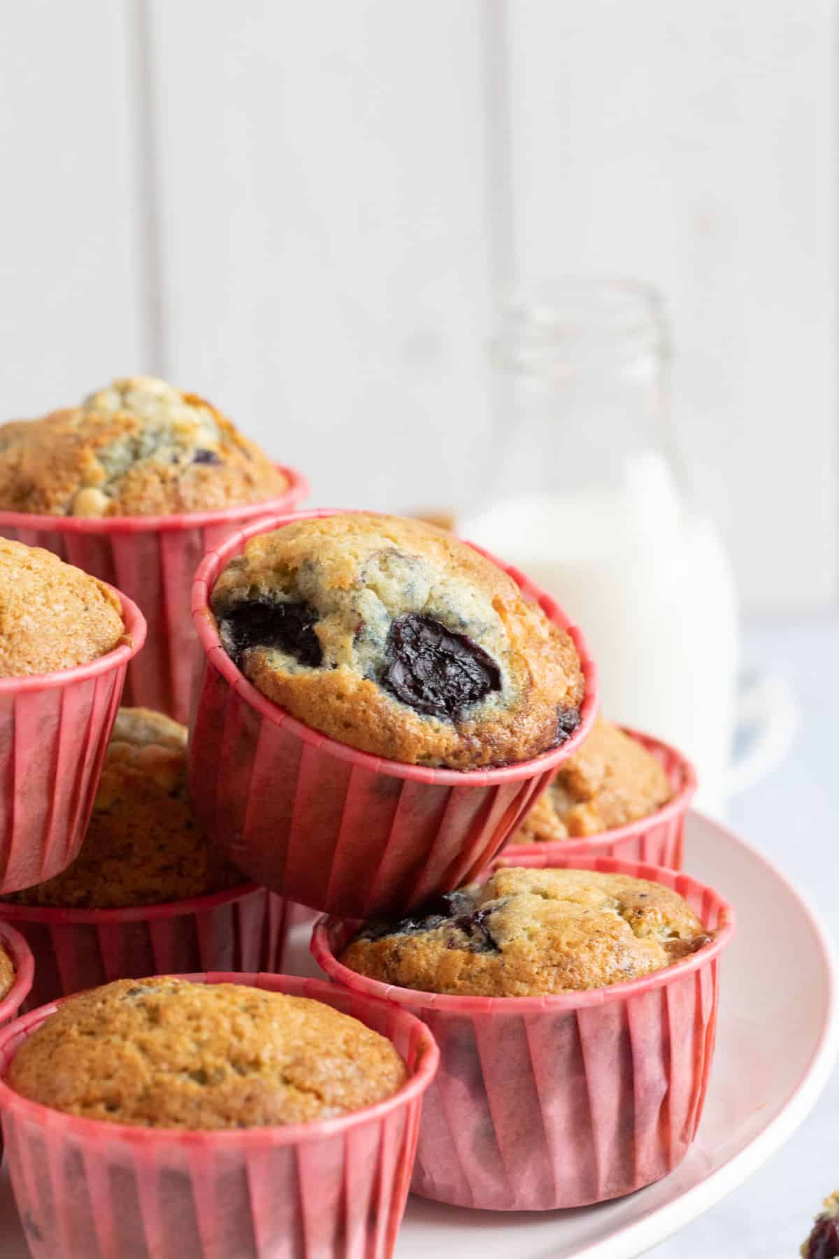 Chocolate Cherry Muffins stacked on a cake stand.