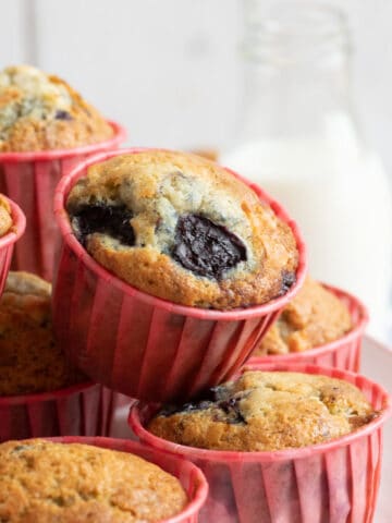 Cherry muffins on a cake stand.