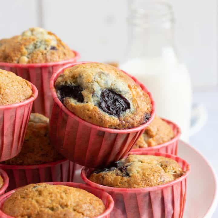 Cherry muffins on a cake stand.