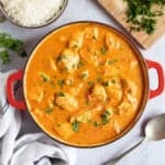 Chicken tikka masala in a red pan.