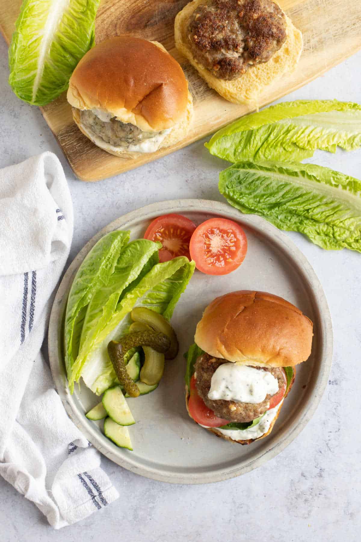 Lamb mince burgers served in brioche buns with salad.