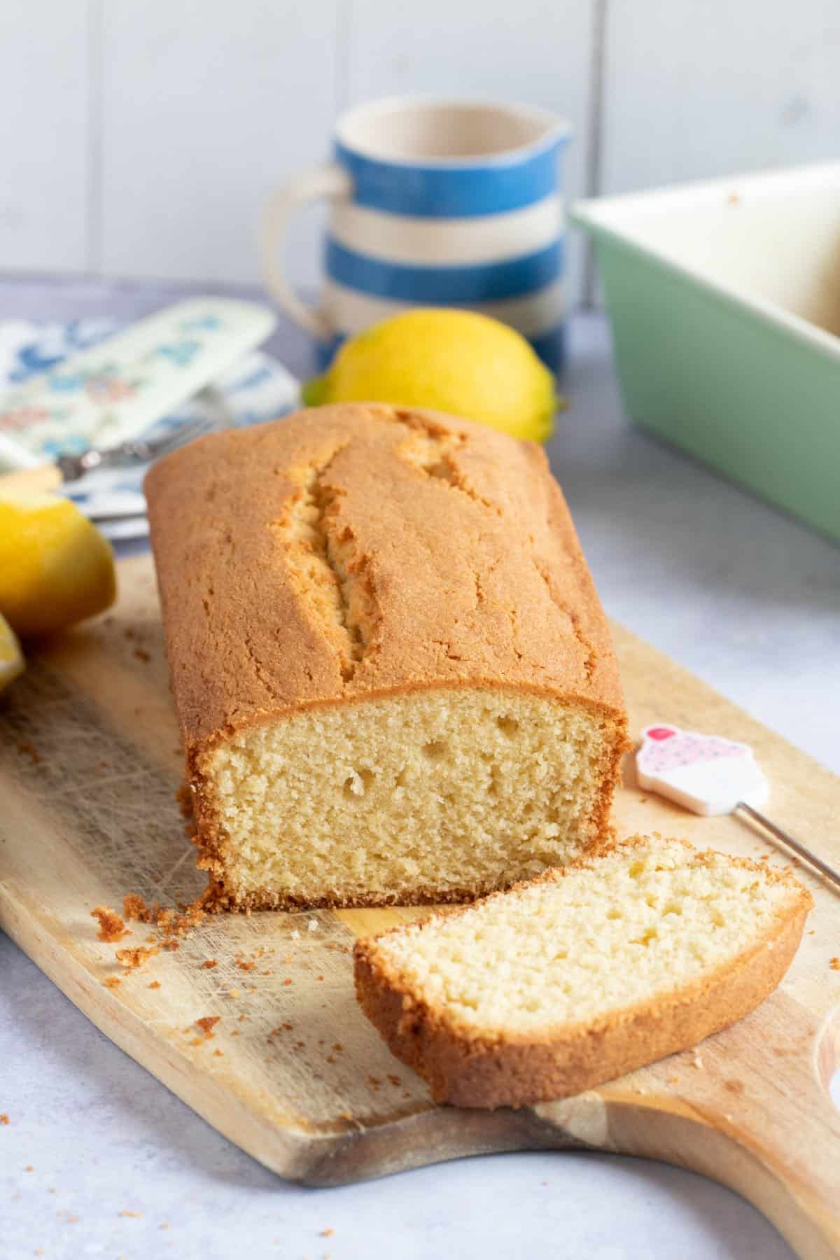 Plain Madeira cake on a wooden board.