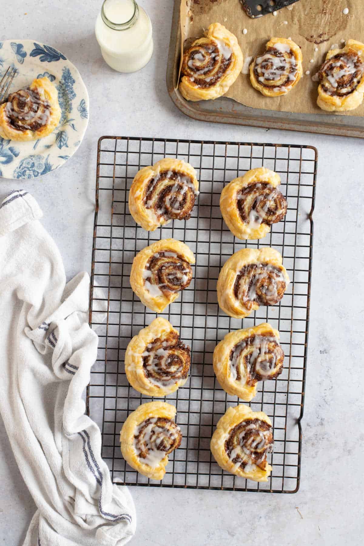 Cinnamon swirls on a wire rack.