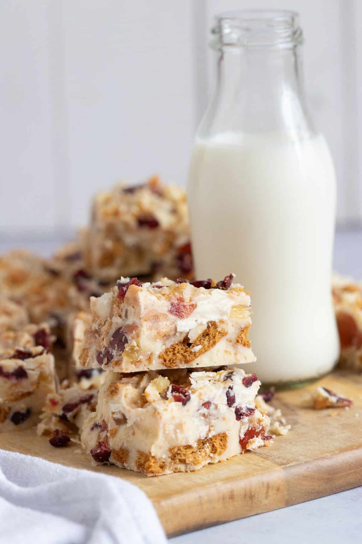 White chocolate tiffin with a glass of milk.