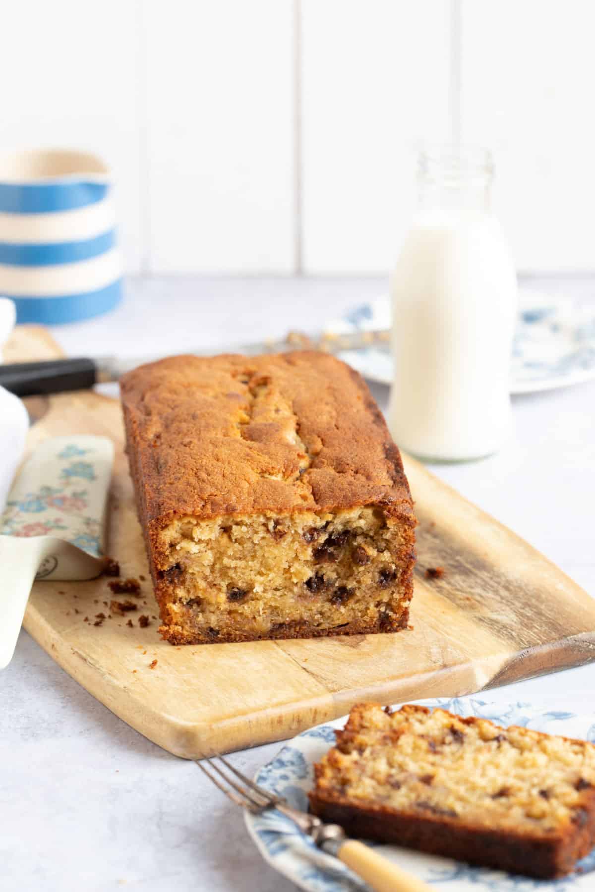 Chocolate chip banana bread on a wooden board.