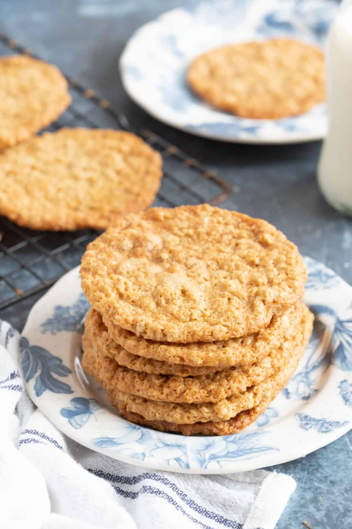 Golden syrup cookies cooling on a wire rack.