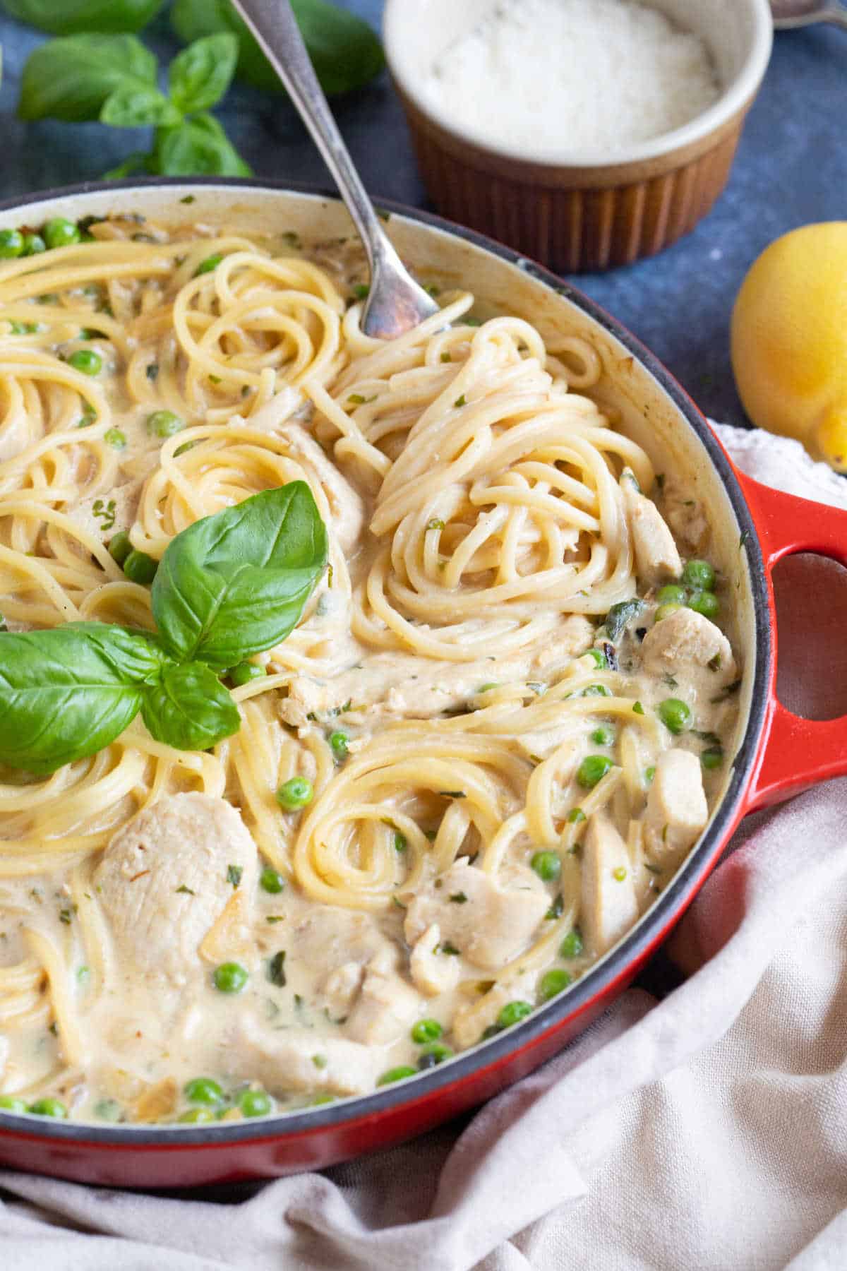 Creamy lemon chicken spaghetti around a fork.