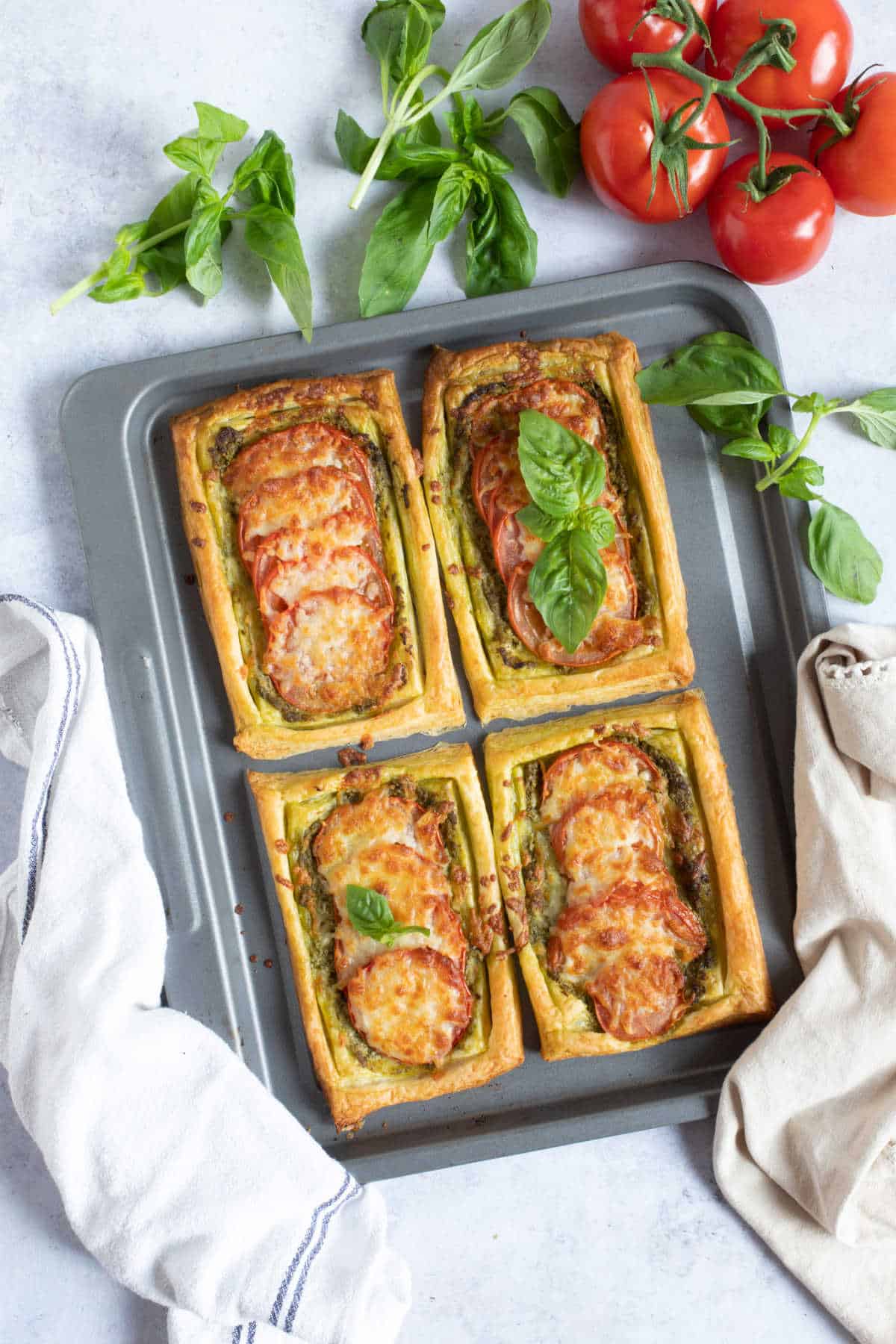 Easy puff pastry tarts on a baking sheet.