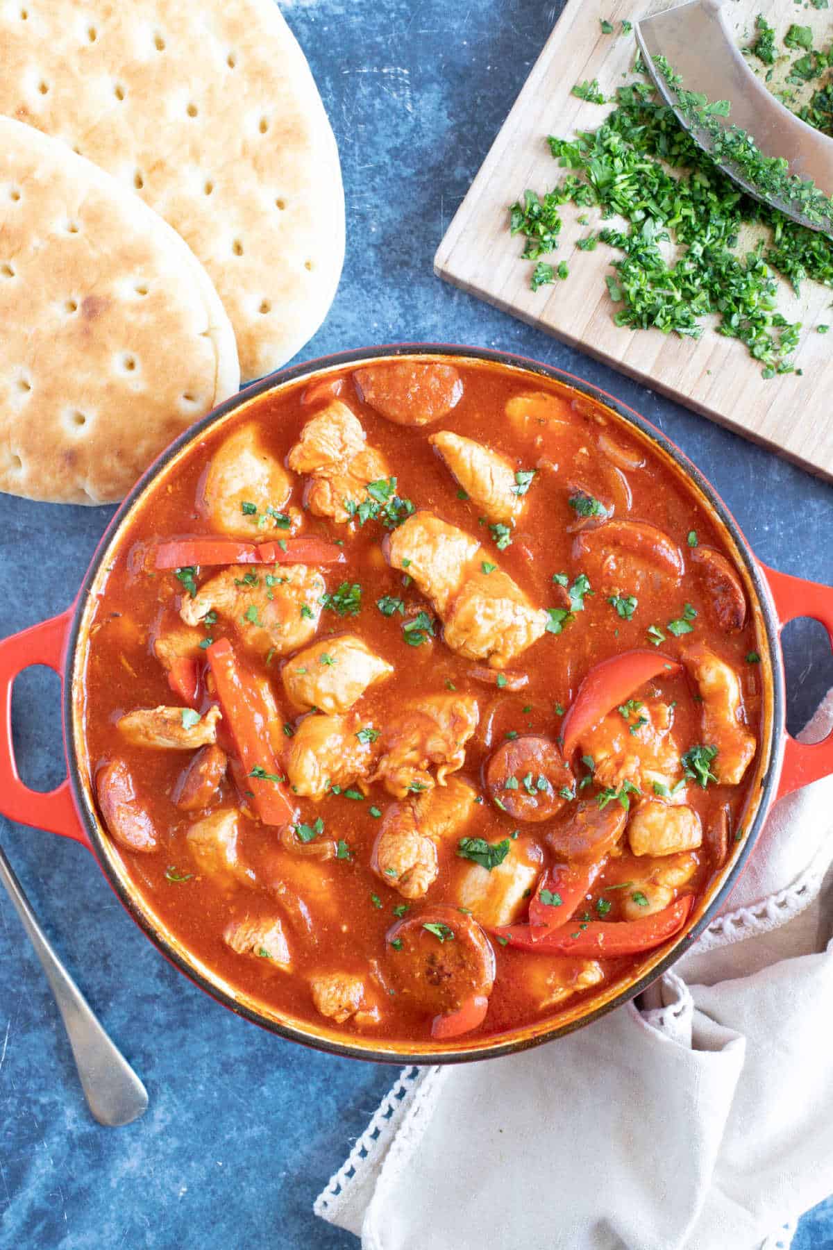 Spanish chicken stew garnished with parsley.