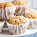 Carrot cake muffins on a cake stand.