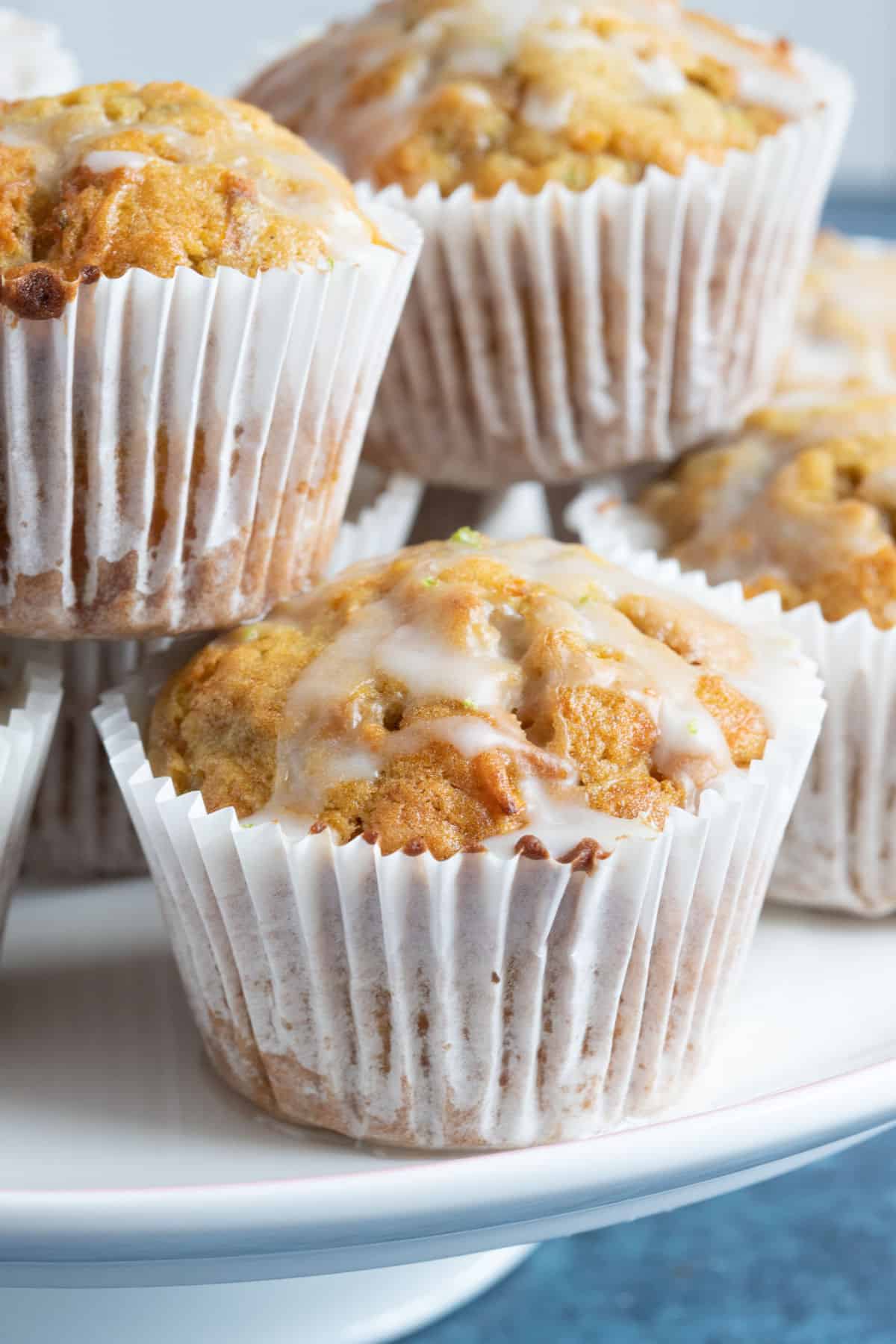 Carrot cake muffins on a cake stand.