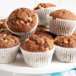 Chocolate banana muffins on a cake stand.