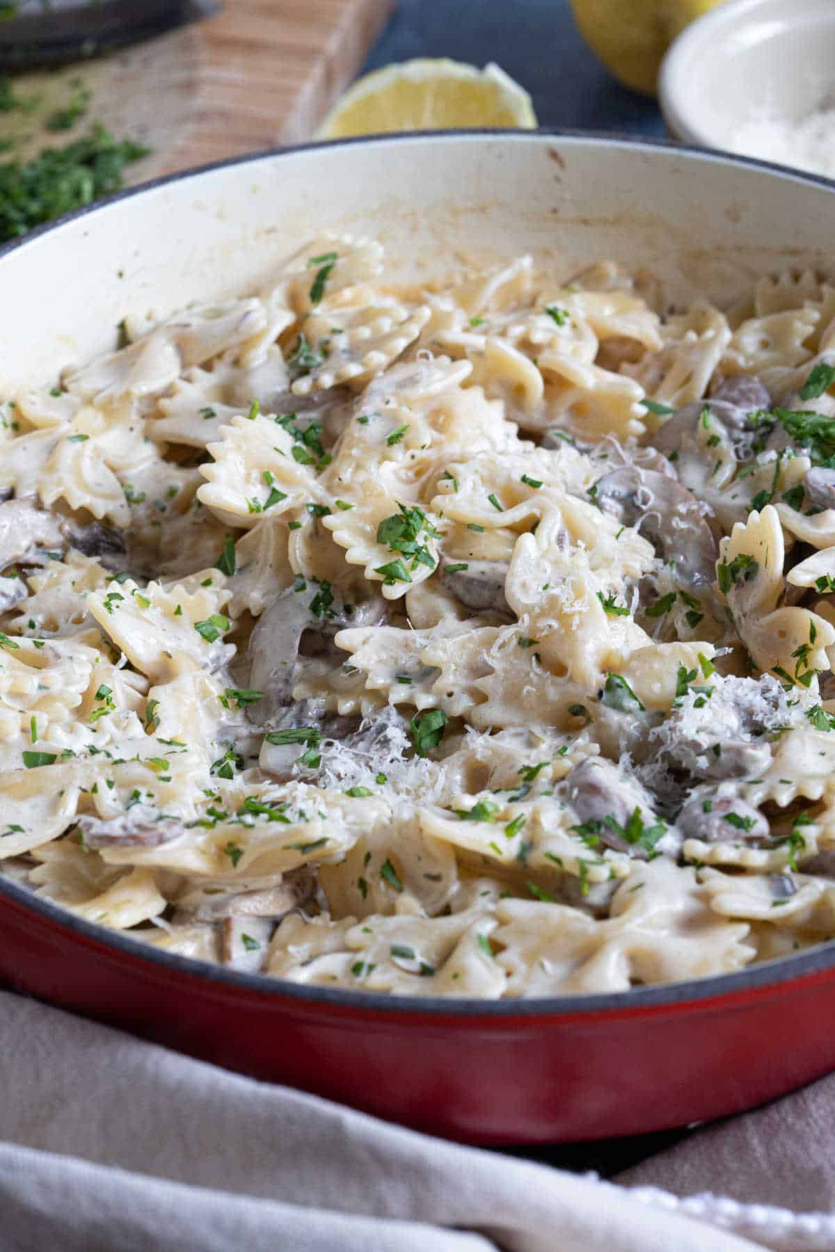 Creamy garlic mushroom pasta in a pan.