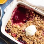Frozen berry crumble in a pie dish.