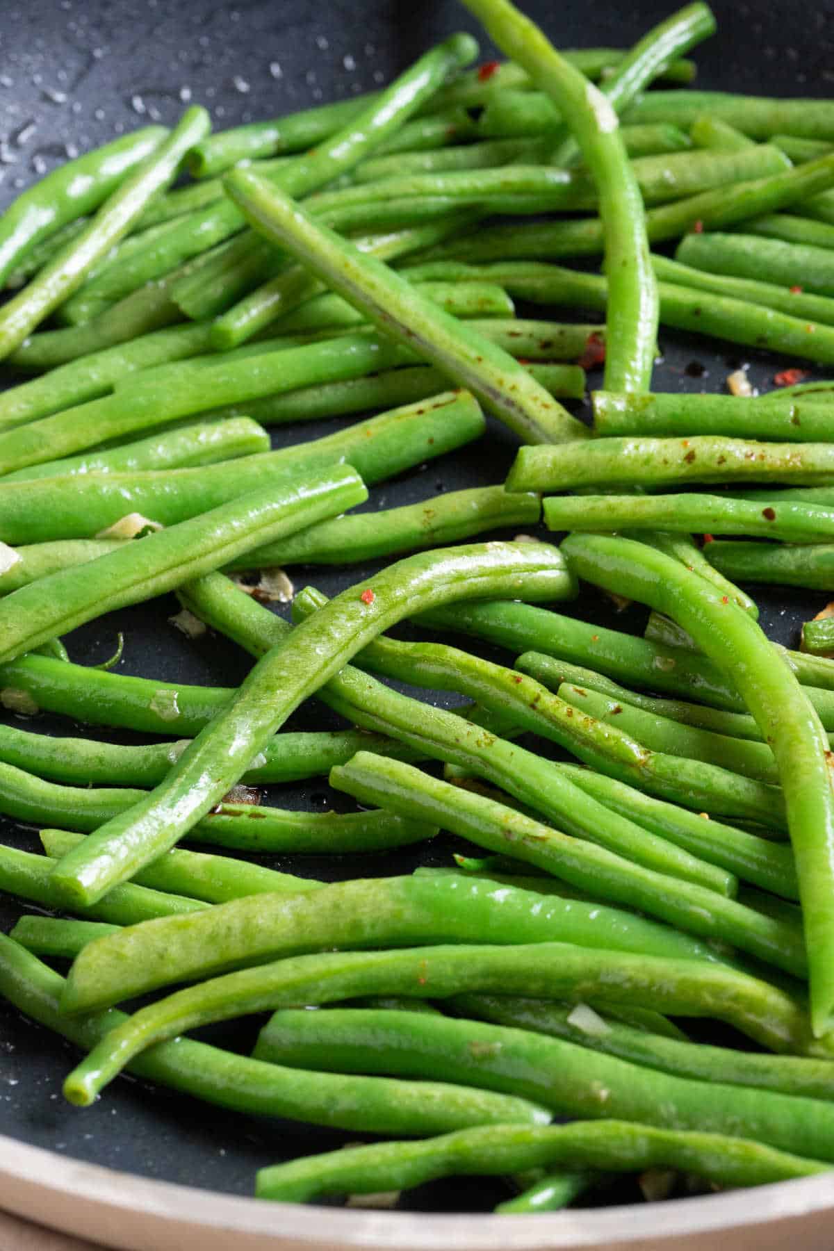 Green beans in a wok.