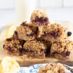 A stack of blackberry crumble bars.