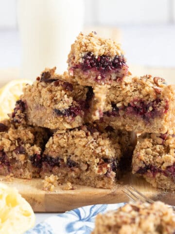 A stack of blackberry crumble bars.