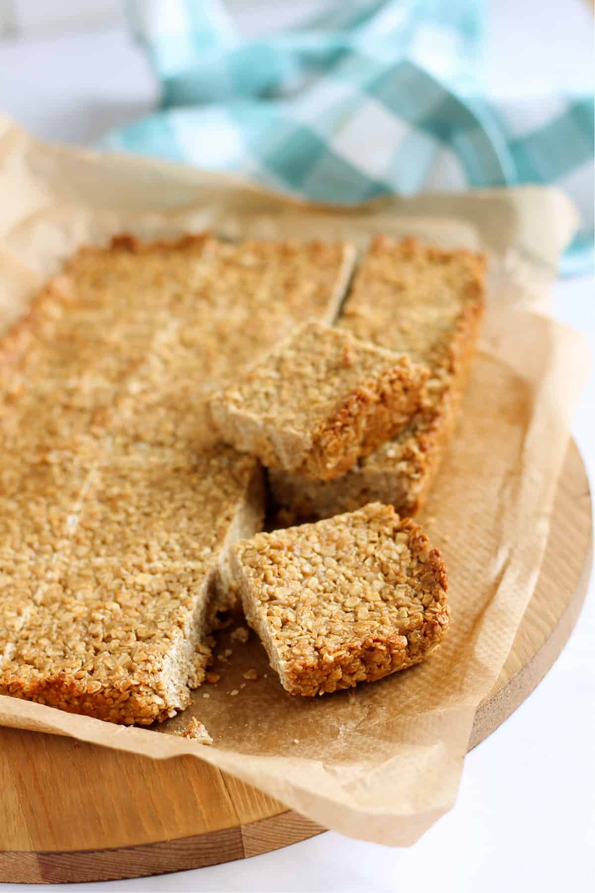 Cut flapjack slices on a chopping board.