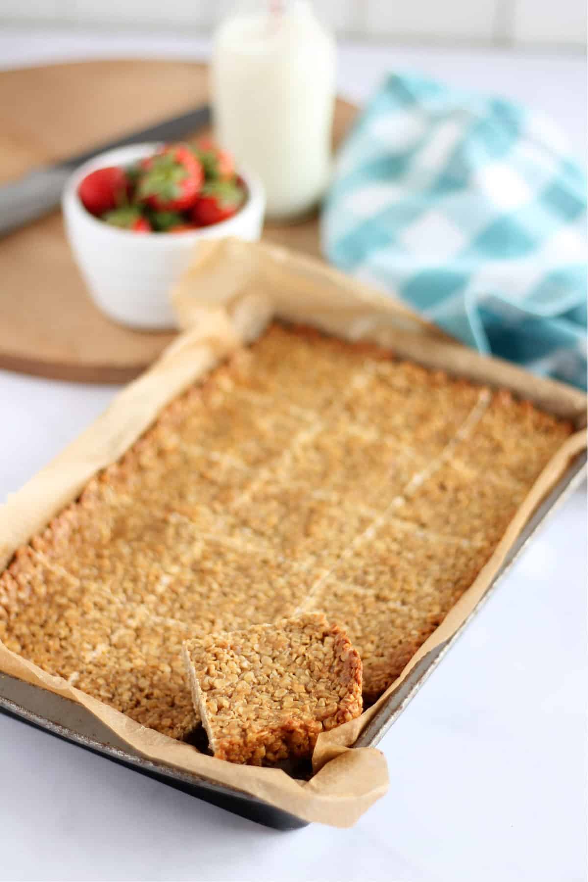 Peanut butter flapjacks in a baking tin.