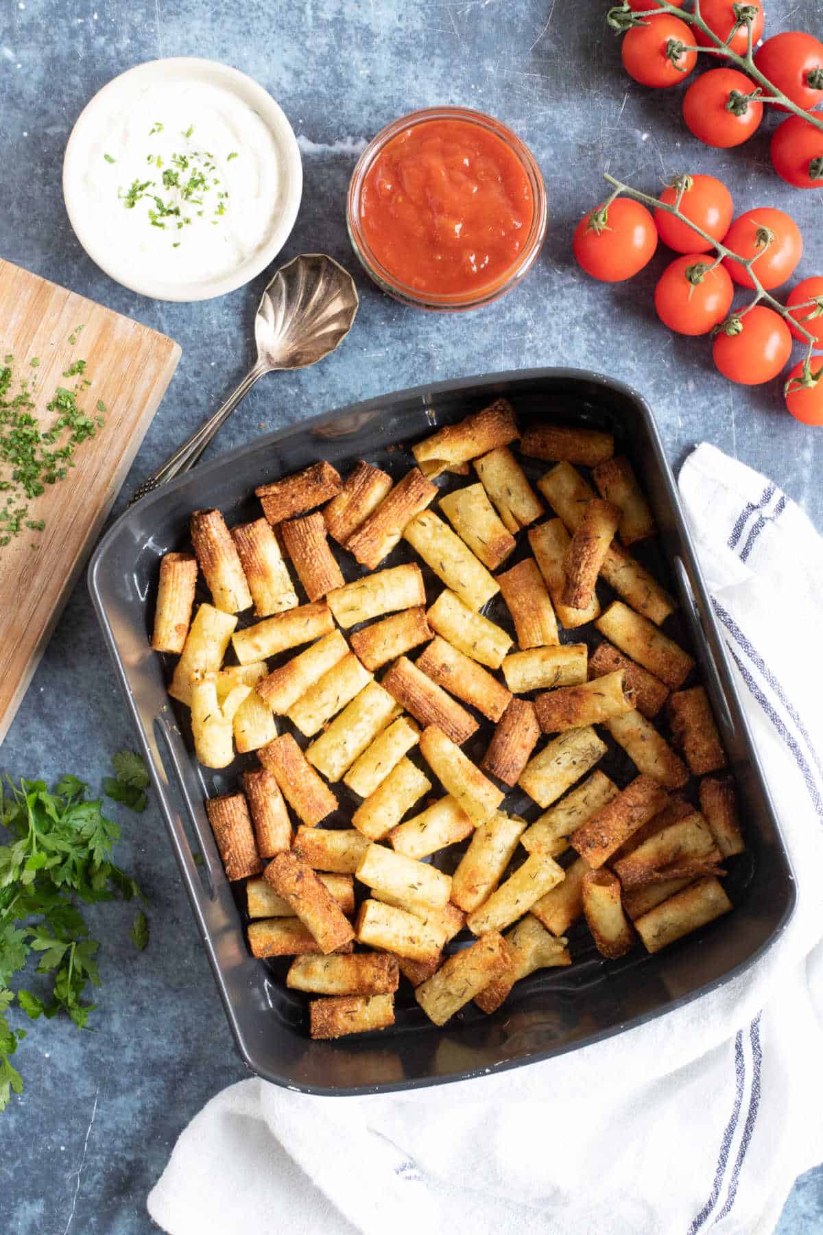 Pasta chips in an air fryer basket.