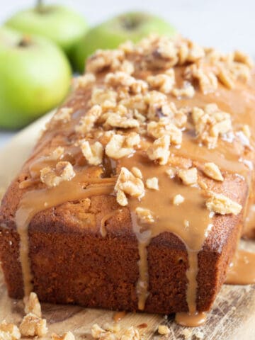 Apple loaf cake on a wooden board.