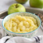 Homemade apple sauce in a blue and white bowl.