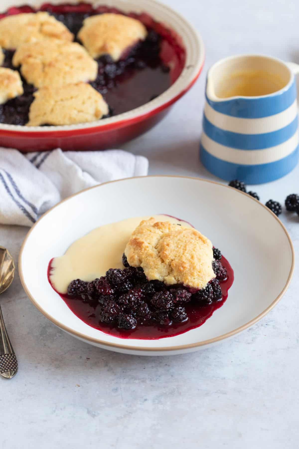 A bowl of blackberry cobbler.