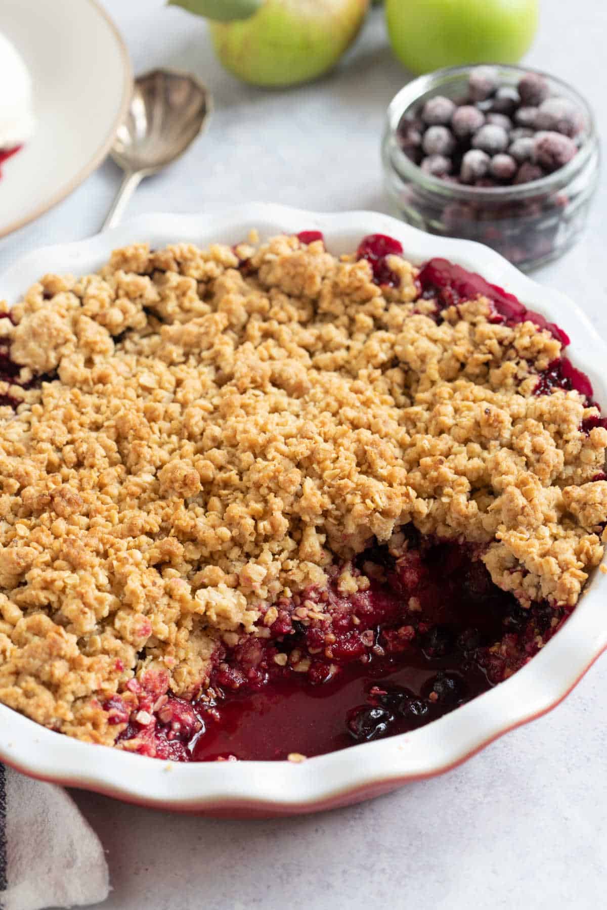 Blackcurrant crumble in a pie dish.