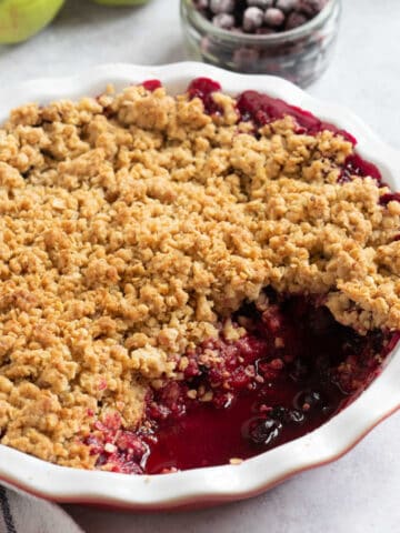 Blackcurrant crumble in a pie dish.