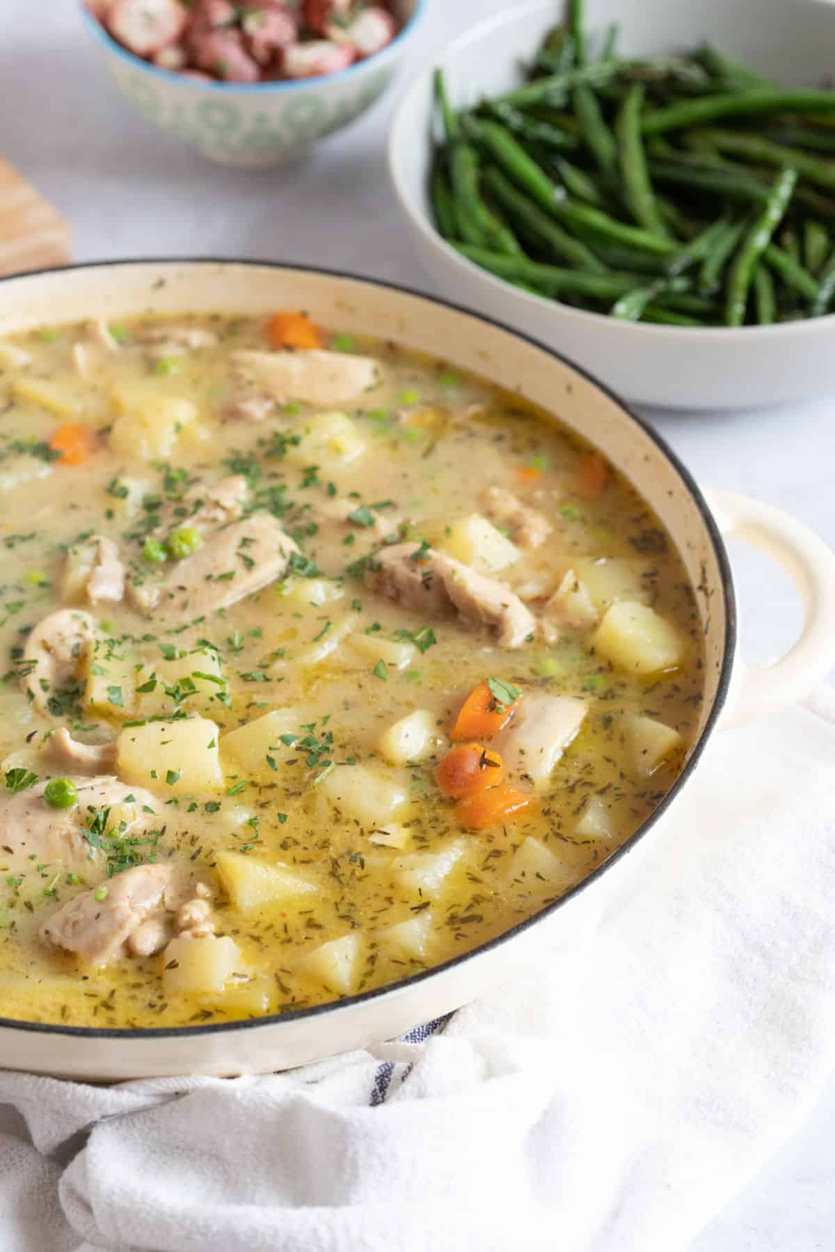 Chicken  and potato stew in a pan.