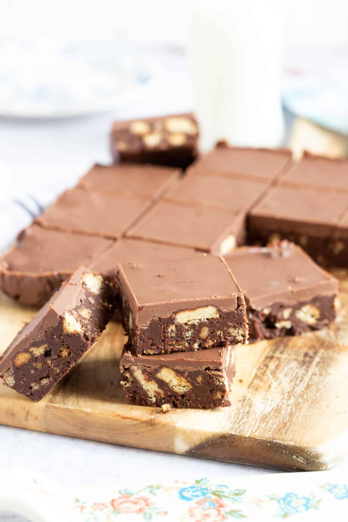 Chocolate tiffin on a wooden board.