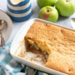 Eve's pudding in a white baking dish.