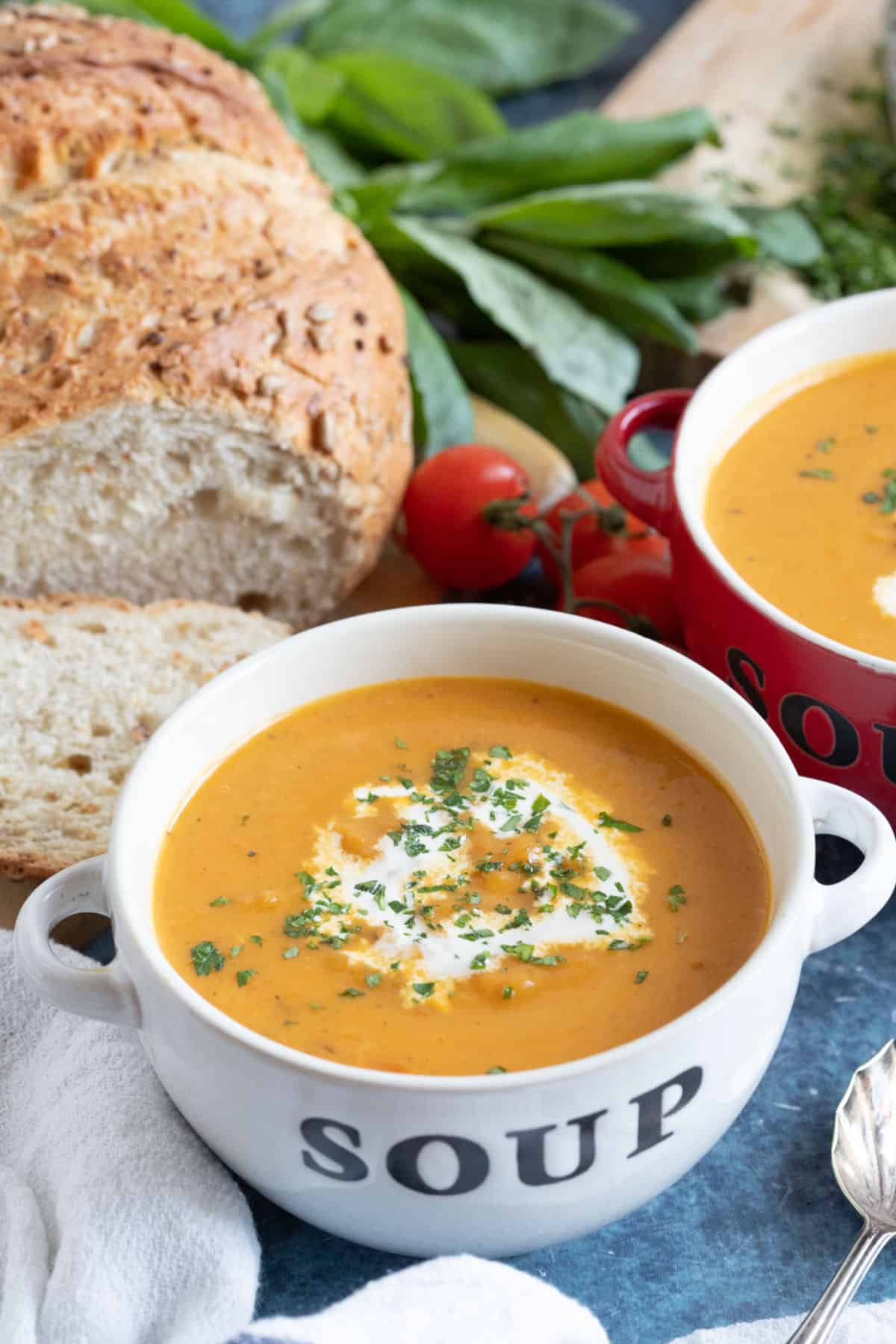 Roasted swede soup in a soup bowl with bread.