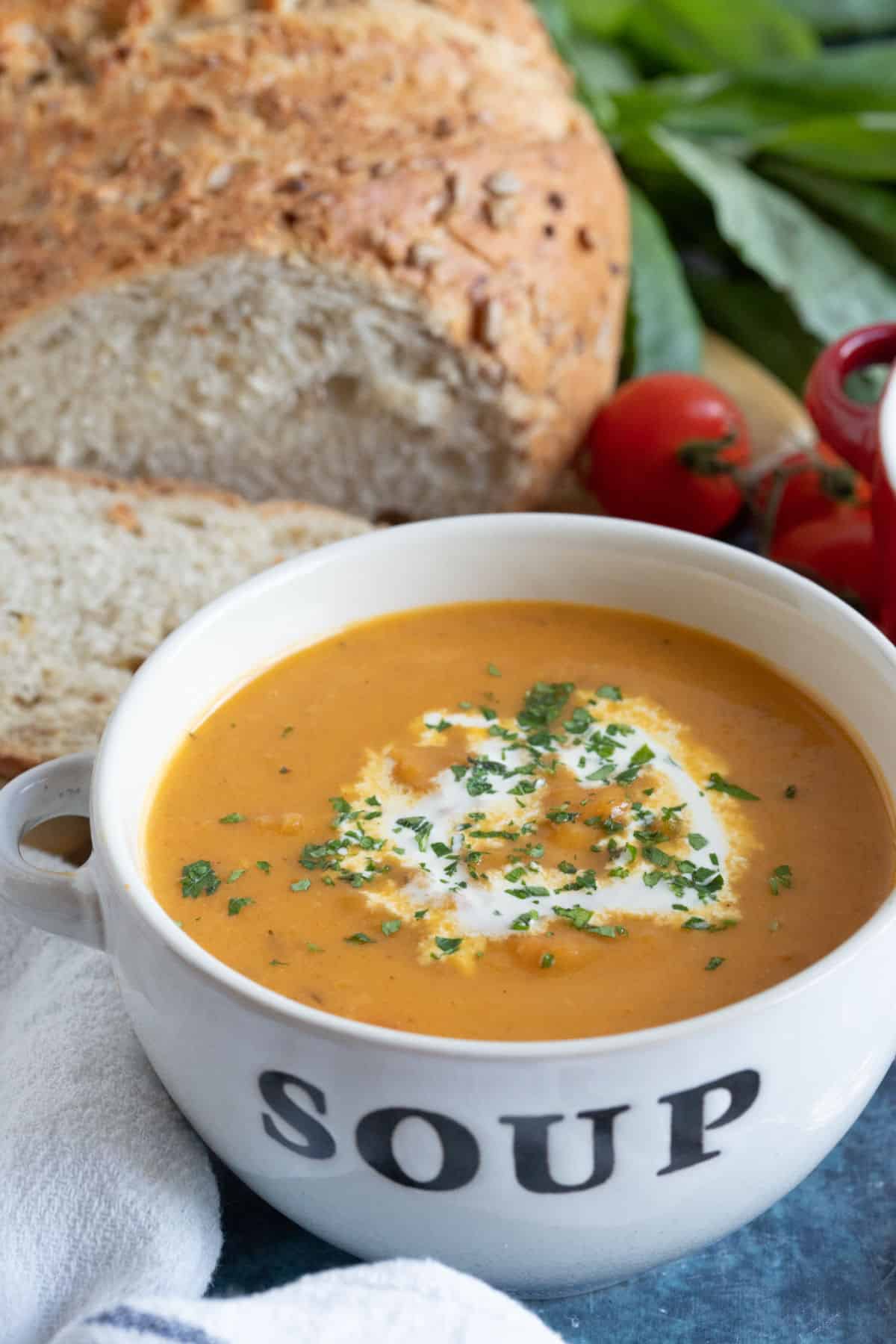 Swede soup in a bowl with a slice of bread.