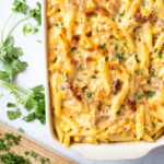 Tuna pasta bake in a white baking dish.