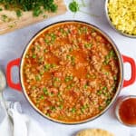 Turkey mince curry in a red pan.