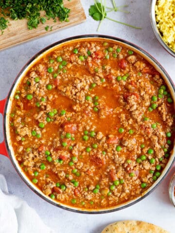 Turkey mince curry in a red pan.