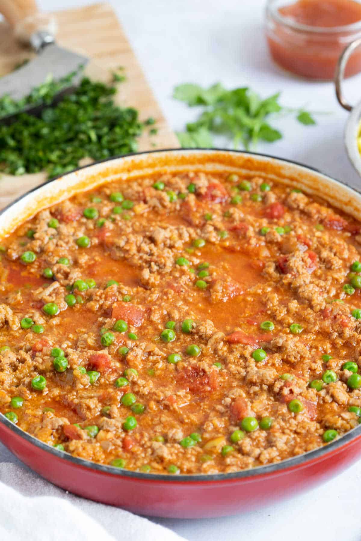 Turkey mince curry in a red pan.