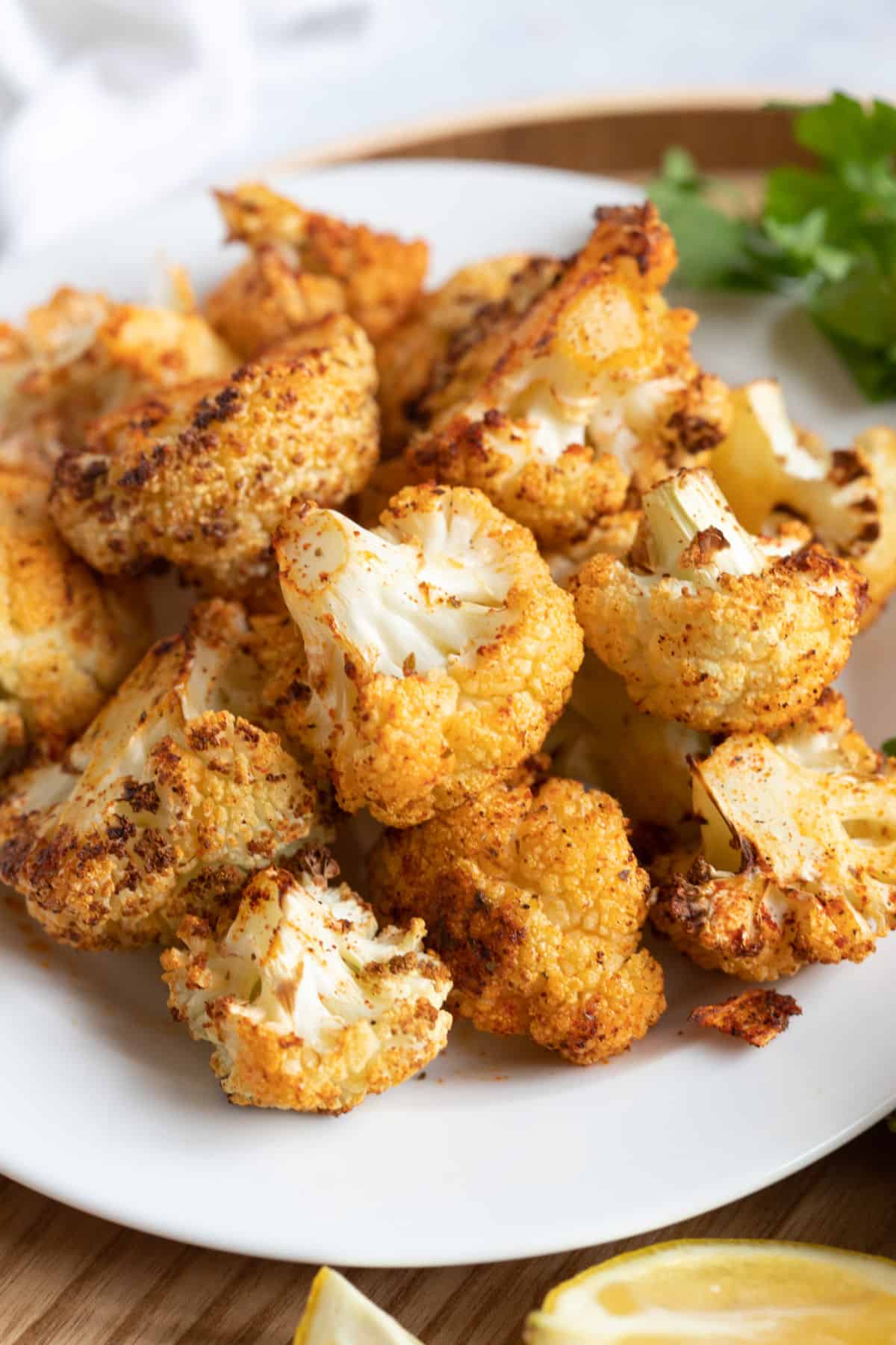 Air fryer cauliflower on a white plate.