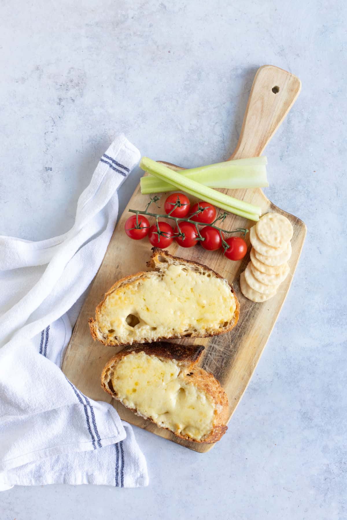 Air fryer cheese on toast with cherry tomatoes.