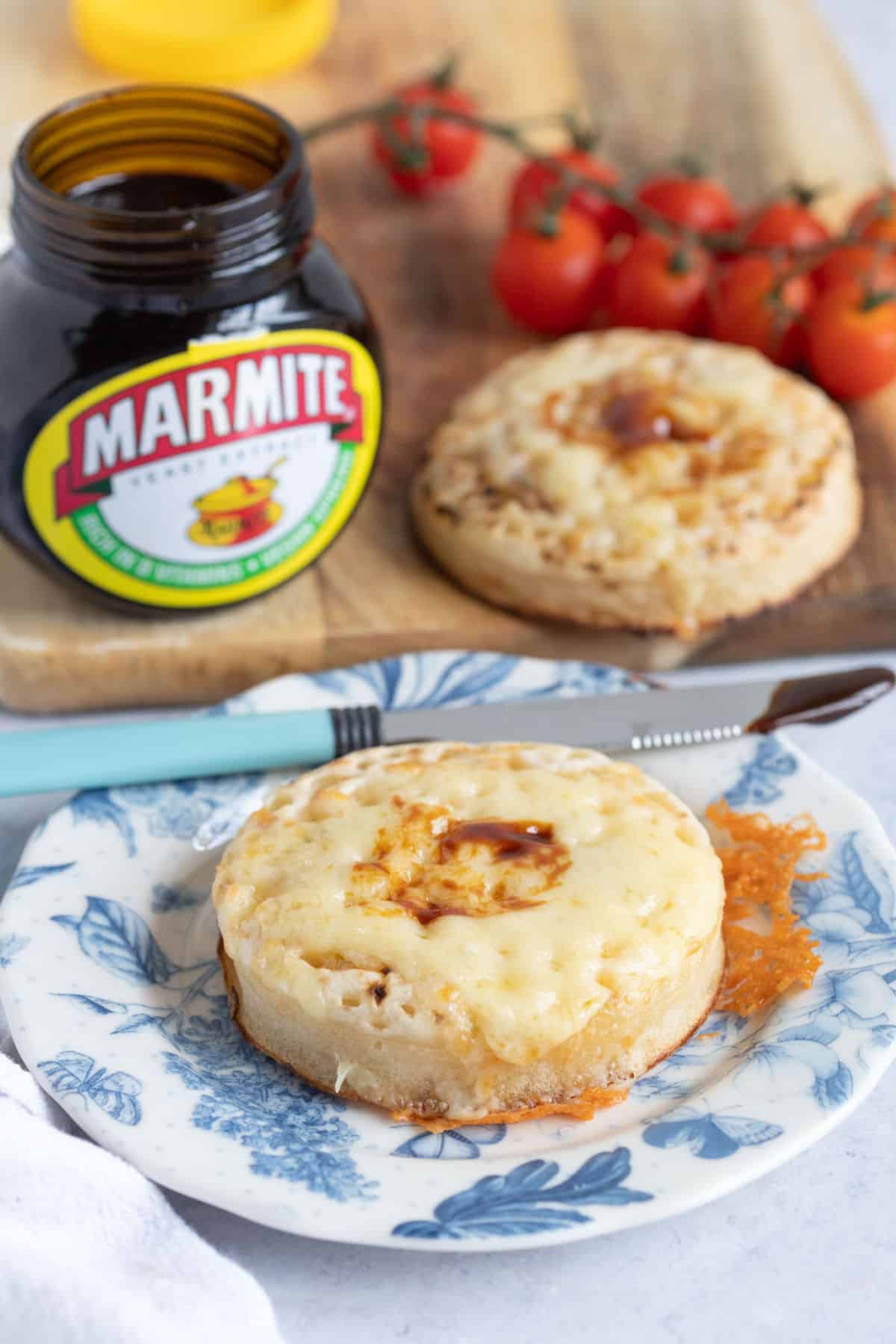 Air fryer crumpets with cheese on a blue plate.