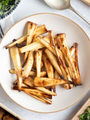 Air fryer parsnips on a plate.