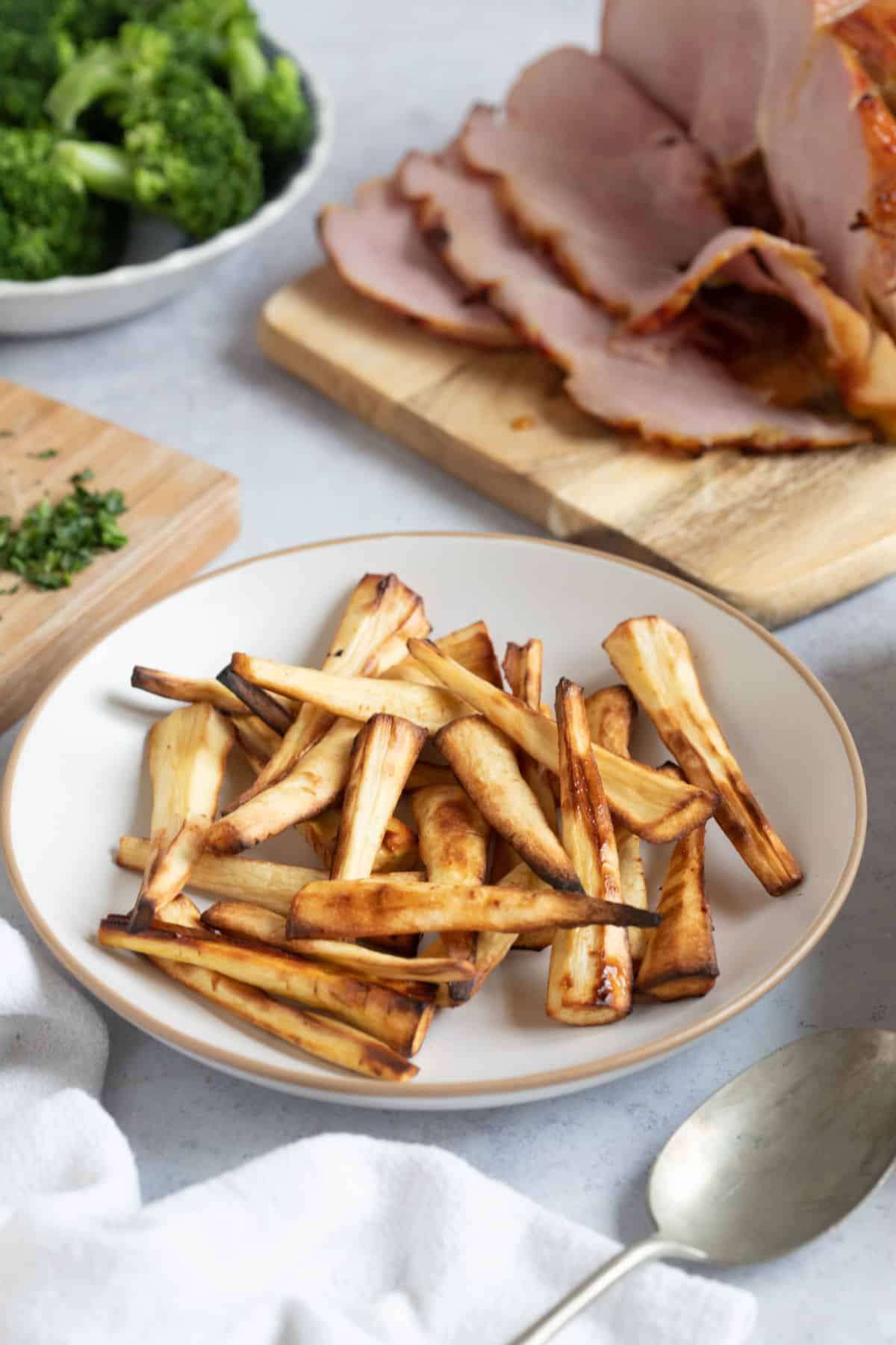 Air fryer parsnips on a plate.